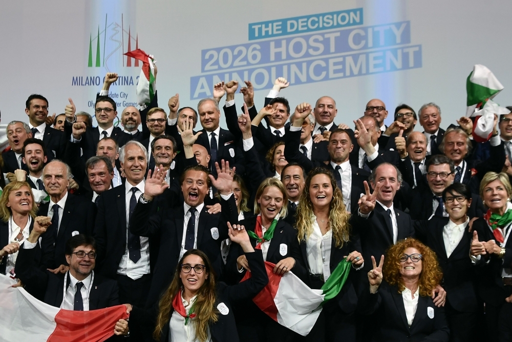 Members of the Italian delegation for 2026 Winter Olympics candidate city react after Milan was elected to host the Winter Olympic Games