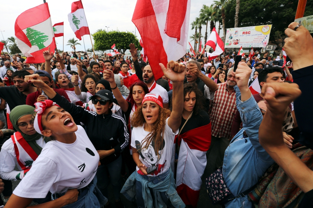 Image result for LEBANON PROTESTS YOUTHS DITCH THEIR DIFFERENCES TO TARGET 'UNJUST' SYSTEM