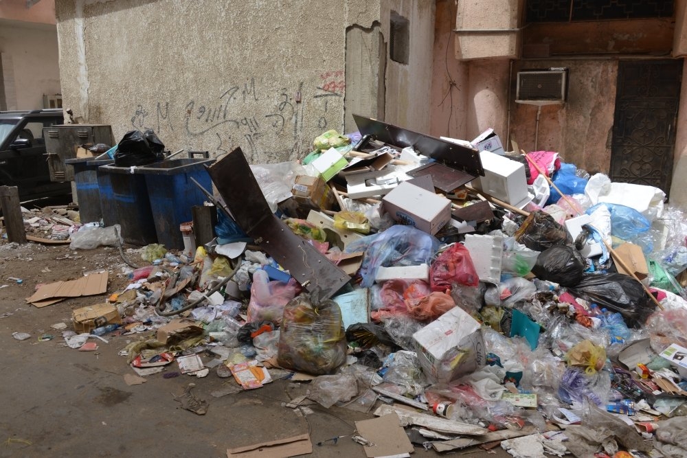 Shop owners and residents say accumulating garbage in Bab Sharif gave an uncivilized look to the historic district of Jeddah. — Courtesy Al-Madina