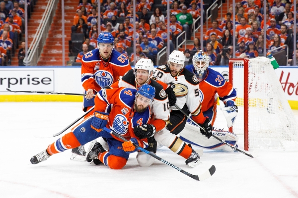 Matthew Benning No. 83 and Kris Russell No. 4 of the Edmonton Oilers battle against Corey Perry No. 10 and Antoine Vermette No. 50 of the Anaheim Ducks in Game Six of the Western Conference Second Round during the NHL Stanley Cup Playoffs at Rogers Place on Sunday in Edmonton, Alberta, Canada. – AFP