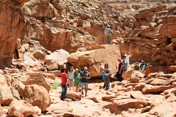 Tourists walk through the colored canyon as part of a tour in Taba's Protected Area in Egypt's southern Sinai resort town. — AFP