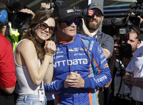 Scott Dixon, of New Zealand, watches with his wife, Emma, the final attempt to knock him off the pole during qualifications for the Indianapolis 500 IndyCar auto race at Indianapolis Motor Speedway, Sunday, in Indianapolis. — AP