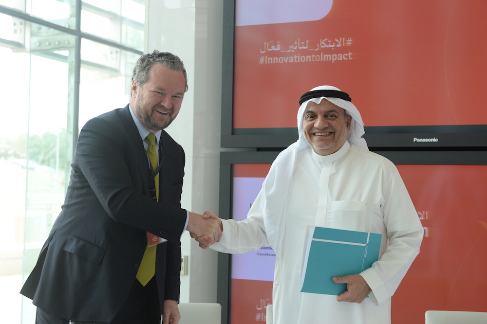 Governor of the SME Authority Dr. Ghassan Al Sulaiman and Vice-Chairman of Global Consulting at Deloitte John Kerr shake hands after HUB1006 signing ceremony in Riyadh on Monday. — Courtesy photo