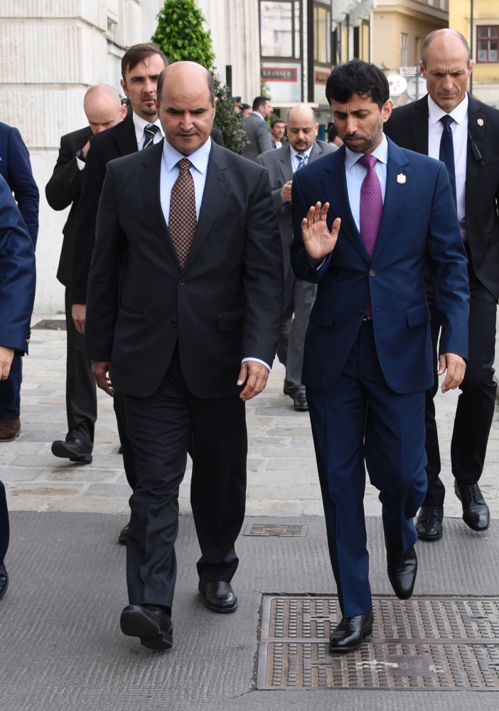 UAE Minister of Energy Suhal Mohamed Al Mazrouri (R) and Kuwat's Minister of Oil  Issam A Almarzoog take a walk in Vienna, Austria on May 24on the eve of the Organization of the Petroleum Exporting Countries meeting — AFP
