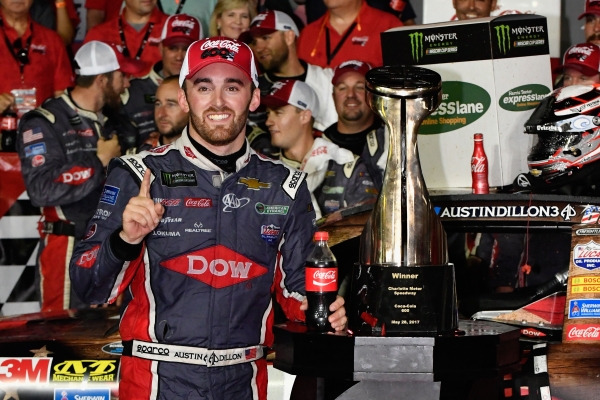 Austin Dillon, driver of the No. 3 DOW Salutes Veterans Chevrolet, poses for a photo with the trophy after winning the Monster Energy NASCAR Cup Series Coca-Cola 600 at Charlotte Motor Speedway on Sunday in Charlotte, North Carolina.— AFP