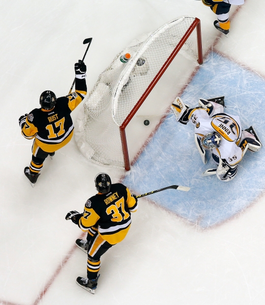 Bryan Rust No. 17 of the Pittsburgh Penguins celebrates a goal past Pekka Rinne No. 35 of the Nashville Predators in Game One of the 2017 NHL Stanley Cup Final at PPG Paints Arena on Monday in Pittsburgh, Pennsylvania. — AFP
