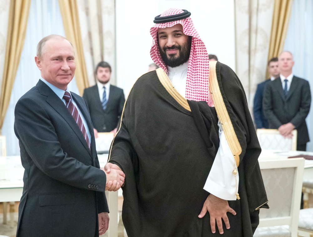 Russian President Vladimir Putin shakes hands with Deputy Crown Prince Muhammad Bin Salman, second deputy premier and minister of defense, during a meeting at the Kremlin in Moscow on Tuesday. — AFP

