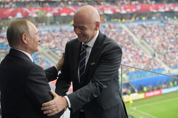 In this Saturday file photo, Russian President Vladimir Putin, left, and FIFA President Gianni Infantino shake hands during the Confederations Cup, Group A soccer match between Russia and New Zealand, at the St. Petersburg Stadium, in St. Petersburg, Russia. — AP