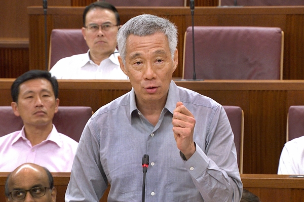 Singapore’s Prime Minister Lee Hsien Loong speaks in parliament in Singapore on Tuesday. — AFP