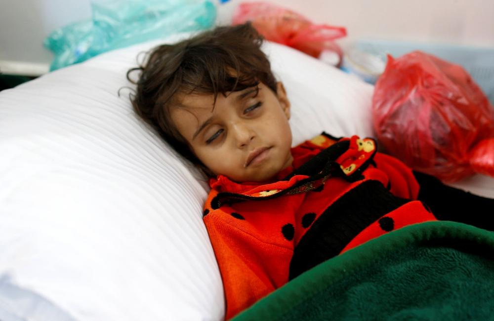 A girl infected with cholera lies on the ground at a hospital in Sanaa. — Reuters