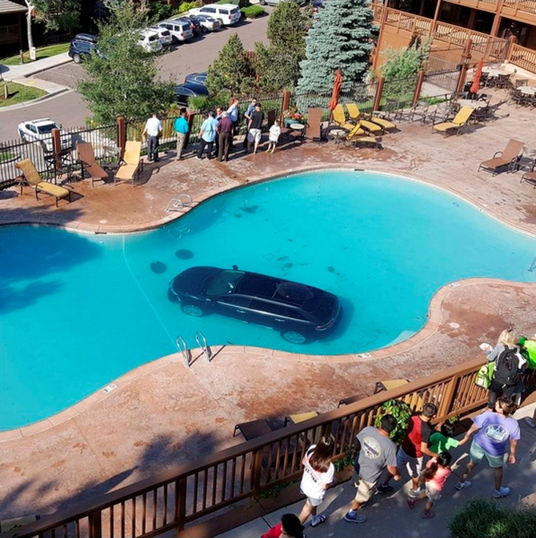 A car is pictured in a swimming pool at the Cheyenne Mountain Resort in Colorado Springs on Tuesday in this picture obtained from social media. - AFP