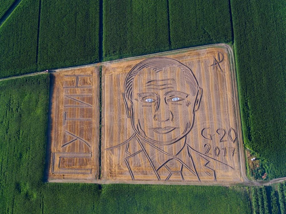 A giant portrait of Russian President Vladimir Putin is seen in a field in Castagnaro, near the northern Italian city of Verona, on Tuesday. - AP