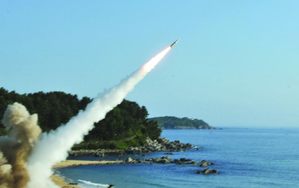 This handout photo provided by US Forces Korea (USFK) in Seoul shows US M270 Multiple Launch Rocket System firing an MGM-140 Army Tactical Missile into the East Sea from an undisclosed location on South Korea's east coast during a South Korea-US joint missile drill aimed to counter North Korea’s ICBM test. — AFP