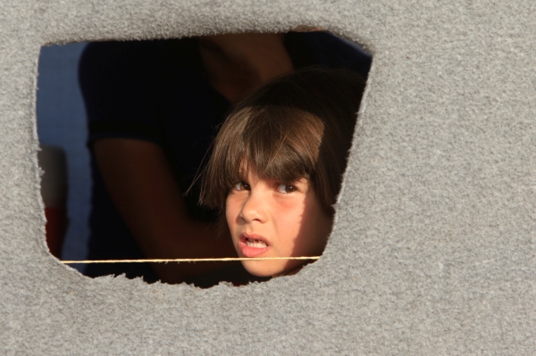 A displaced boy is seen from Hassan Sham camp, east of Mosul. — Reuters