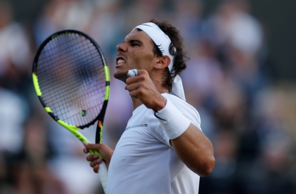 Spain’s Rafael Nadal celebrates saving match point during his fourth round match against Luxembourg’s Gilles Muller. Nadal lost to Muller in a five-set epic in Wimbledon on Monday. — Reuters    