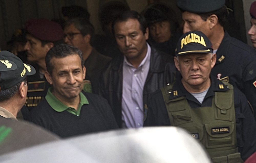 Peru’s former President Ollanta Humala, left, is escorted out of the Palace of Justice to the Diones prison where ex-President Alberto Fujimori is serving time in Lima, on Friday. — AP
