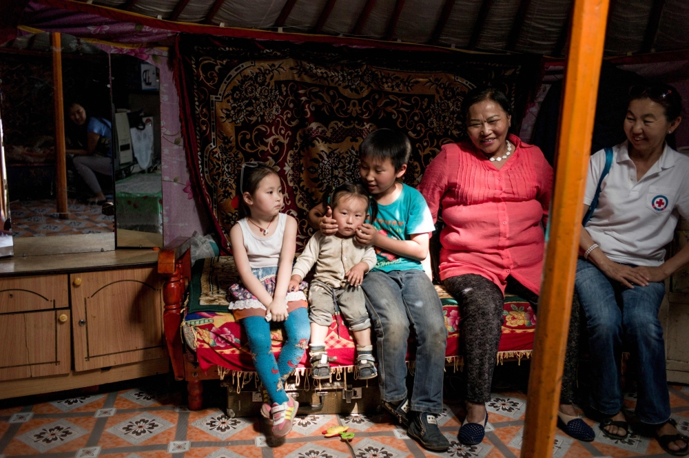 This photo taken on June 24, 2017 shows a family resting in a yurt, a traditional Mongolian house, on the outskirts of Ulan Bator. On the steep hills encircling Mongolia’s capital, skyscrapers and apartments give way to ramshackle bungalows and tattered yurts, in rickety fenced enclosures with no running water - it is home to many of the landlocked country’s nomadic herders, who migrated here in search of a better life. - AFP