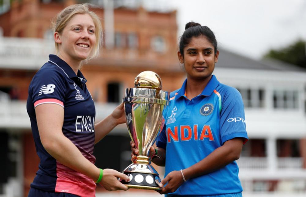 England’s Heather Knight (L) and India’s Mithali Raj pose with the Women’s Cricket World Cup Trophy in London Saturday. — Reuters
