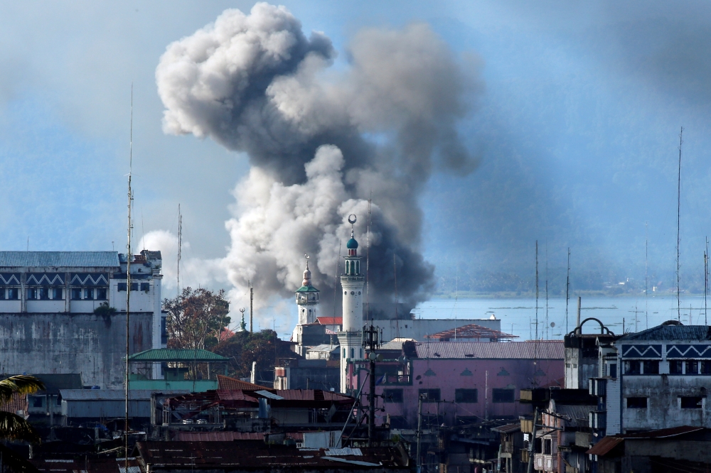 An explosion is seen after a Philippines army aircraft released a bomb during an air strike as government troops continue their assault against insurgents from the Maute group in Marawi city in this June 27, 2017 file photo. — Reuters