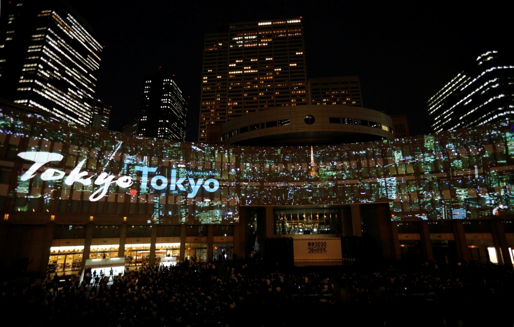 Images, using projection-mapping technology, are beamed on a building of Tokyo Metropolitan Government Office during a countdown event to mark three years until the Tokyo 2020 Summer Olympics in Tokyo, Japan July 24, 2017.  REUTERS/Toru Hanai