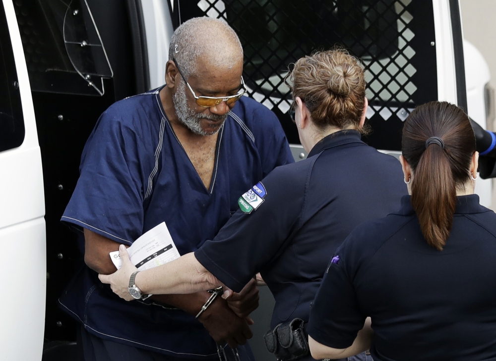 Driver James Mathew Bradley Jr., left, arrives at the federal courthouse for a hearing in San Antonio, Texas, on Monday. — AP