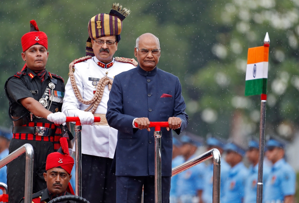 India’s new President Ram Nath Kovind inspects an honor guard after being sworn in at the Rashtrapati Bhavan presidential palace in New Delhi on Tuesday. — Reuters