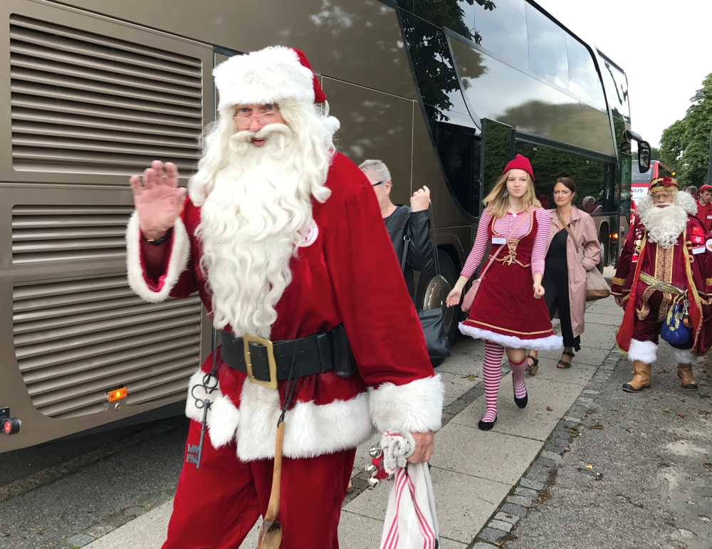 People dressed as Santa Claus take take part in the World Santa Claus Congress, an annual event held every summer in Copenhagen, Denmark on Wednesday. - Reuters