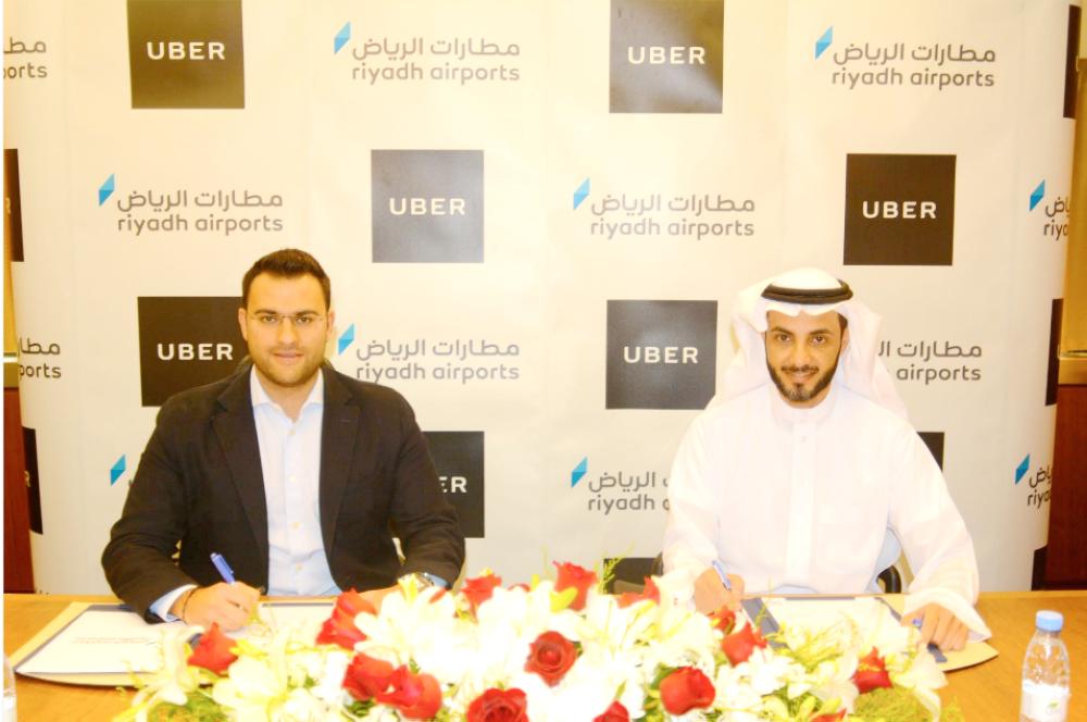 Riyadh Airports and Uber officials sign an accord to ferry KKIA passengers in Riyadh, Tuesday. — Courtesy photo