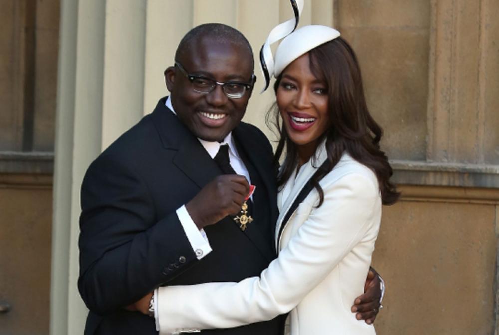 Edward Enninful poses with British model Naomi Campbell as he holds his insignia after being appointed an Officer of the Order of the British Empire (OBE) for services to diversity in the fashion industry at an investiture ceremony at Buckingham Palace in London in this Oct. 27, 2016 file photo. - AFP