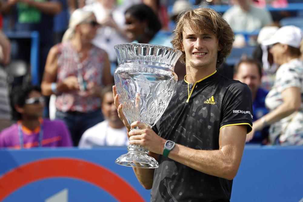 Alexander Zverev of Germany poses with the championship trophy after beating Kevin Anderson of South Africa in the final of the Citi Open at Fitzgerald Tennis Center in Washington Sunday. — Reuters