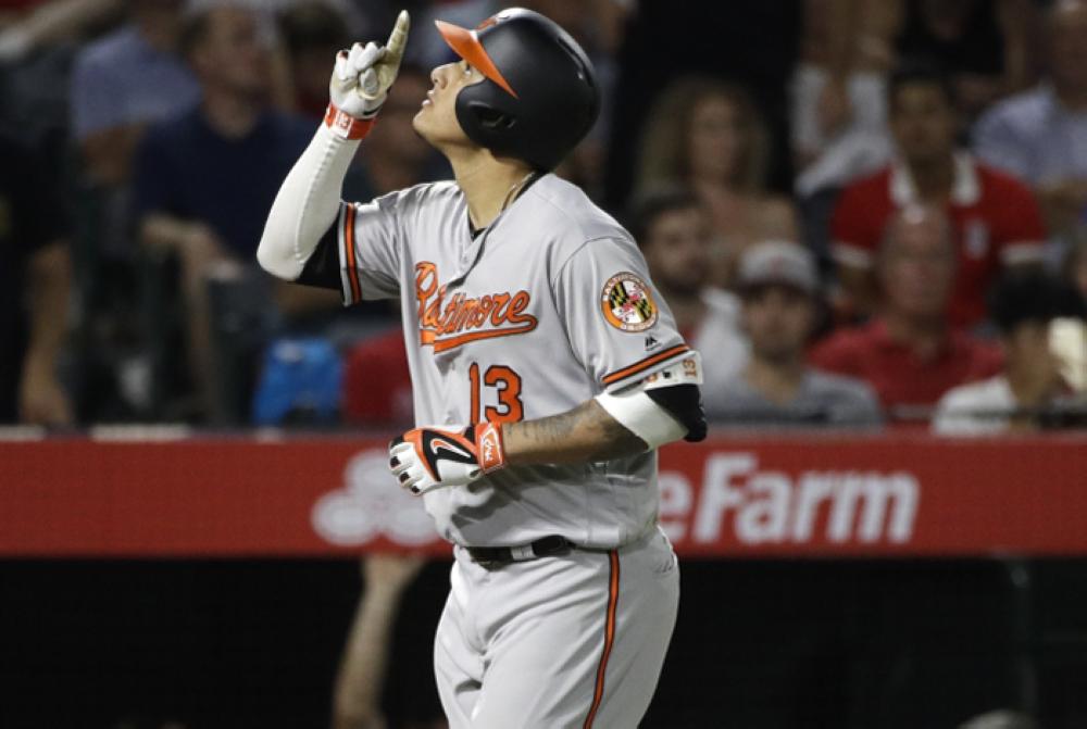 Baltimore Orioles’ Manny Machado celebrates his grand slam during the seventh inning of their game against the Los Angeles Angels in Anaheim Monday. — AP 
