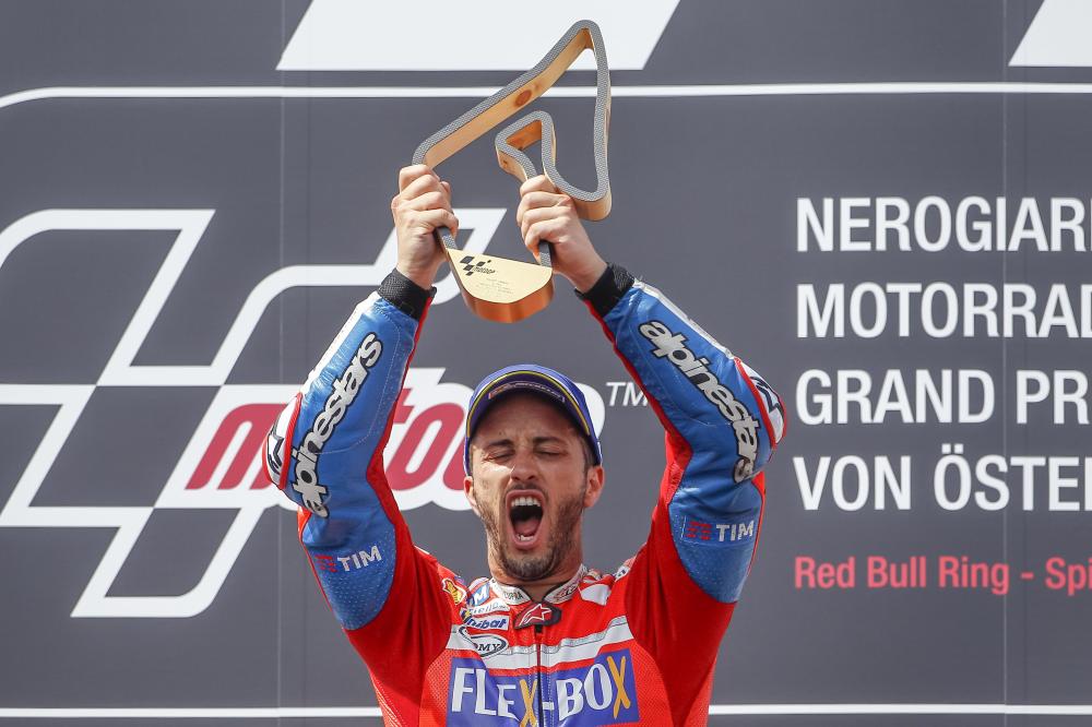 Winner Andrea Dovizioso of Italy (Ducati) poses with the trophy after the race of the Nero Giardini Moto-GP in Spielberg, Austria, Sunday. — AFP