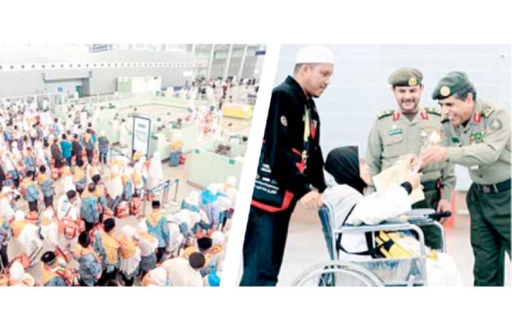 The Director of Jawazat Maj. Gen. Solaiman Al-Yahya receiving a number of Malaysian pilgrims, who had their passports processed at home terminal at Kuala Lumpur, on arrival at KAIA on Sunday. — Courtesy photo