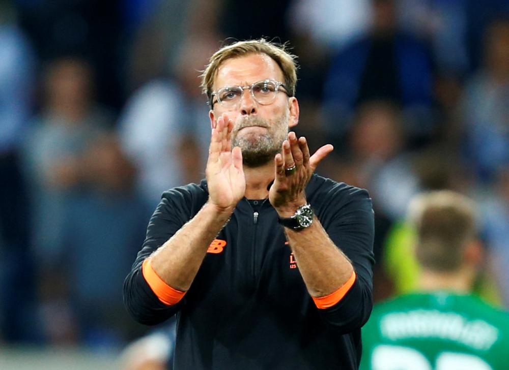 FIle photo shows Liverpool manager Juergen Klopp applauding fans after a match against Hoffenheim in Germany. — Reuters  