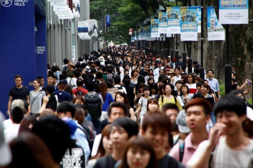 Pedestrians are pictured at a shopping district in Tokyo, Japan. — Reuters