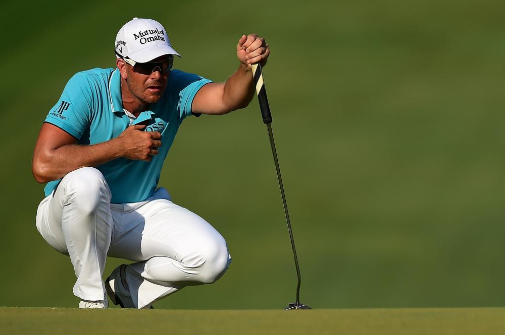 Henrik Stenson of Sweden lines up a putt on the 18th green during the third round of the Wyndham Championship at Sedgefield Country Club in Greensboro, North Carolina, Saturday. — AFP 