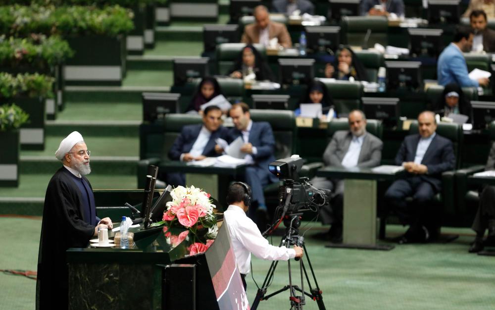 Iranian President Hassan Rohani speaks in parliament in Tehran, Sunday. — AFP