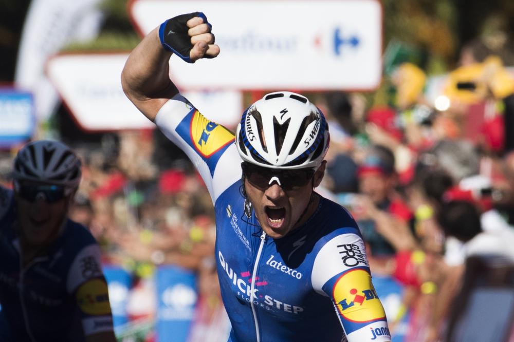 Begium’s cyclist Yves Lampaert of Quick-Step Floors celebrates as he crosses the finish line to win the 2nd stage of the 72nd edition of “La Vuelta” Tour of Spain cycling race, a 203,4km route between Nimes to Gruissan Sunday. — AFP