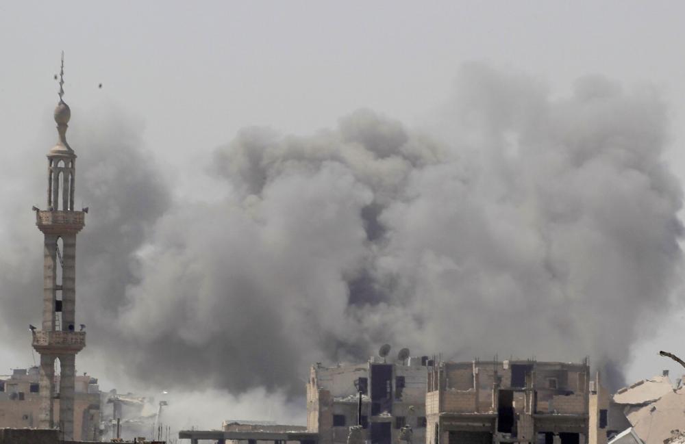 Smoke rises after an airstrike during fighting between members of the Syrian Democratic Forces and Daseh (the so-called IS) militants in Raqqa. — Reuters