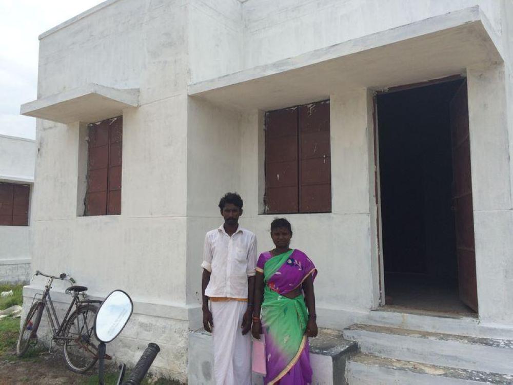 Devi and Selvam outside their under construction home in Thiruvannamalai, India. - Reuters