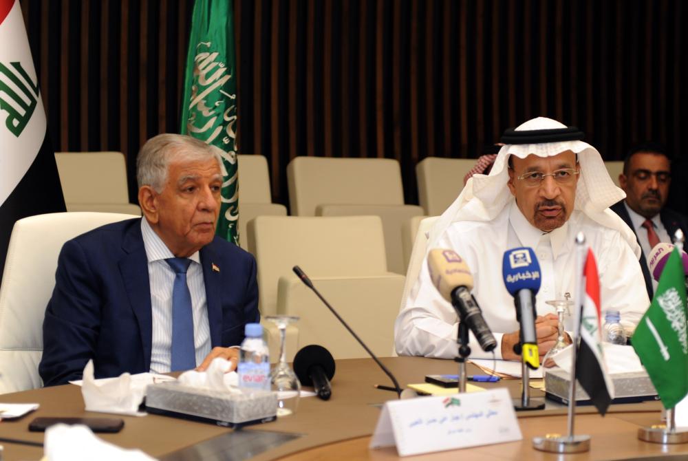 File photo shows Minister of Energy, Industry and Mineral Resources Khalid Al-Falih (R) and Iraqi Oil Minister Jabbar Al-Luaybi. Al-Falih said KSA has invited bids Tuesday from 25 shortlisted companies to build a 400 megawatt wind power project. — AFP