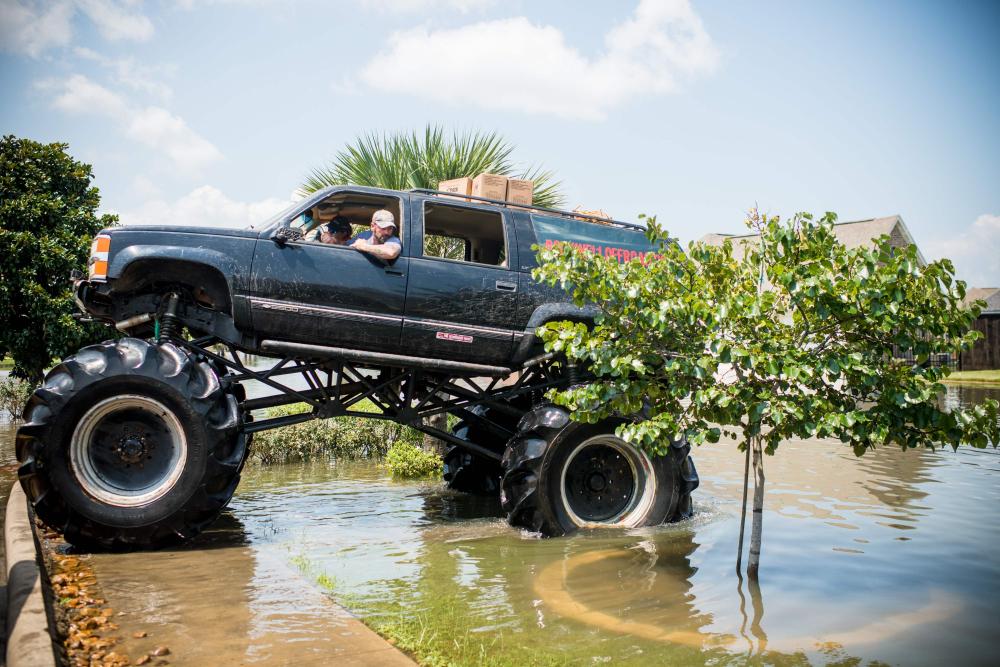 Old Habits, the monster truck, helps rescue residents through floods in Port Arthur, Texas, Friday. Houston was limping back to life on Friday one week after Hurricane Harvey slammed into America's fourth-largest city and left a trail of devastation across other parts of southeast Texas. — AFP