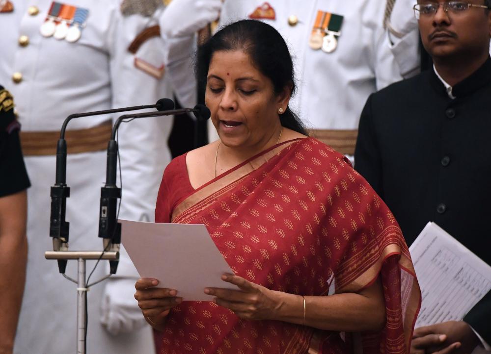 Nirmala Sitharaman takes the oath during the swearing-in ceremony of new ministers at the Presidential Palace in New Delhi. — AFP