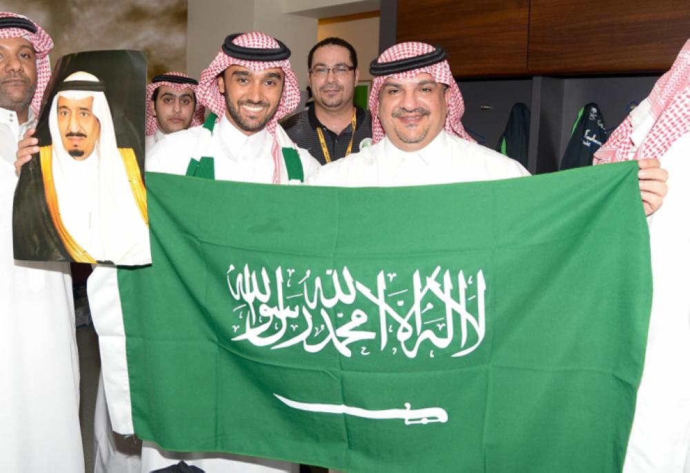 Crown Prince Muhammad Bin Salman, deputy premier and minister of defense, shows victory sign at the end of the World Cup qualifier match at King Abdullah Sports City Stadium in Jeddah on Tuesday night 