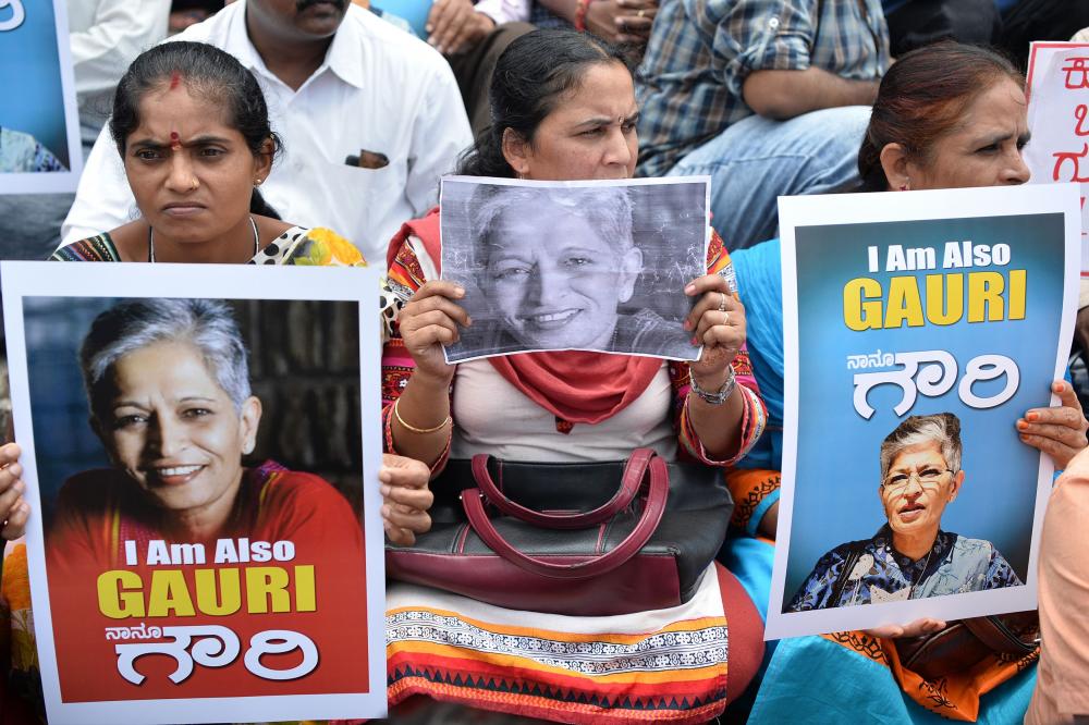 Family members and relatives of 55-year-old Gauri Lankesh, who was shot dead by unknown assailants in the porch of her home in Bangalore mourn her death. Gauri Lankesh was a senior journalist known for her Leftist and anti-Hindutva views and for her criticism of Hindu extremism. — AFP
