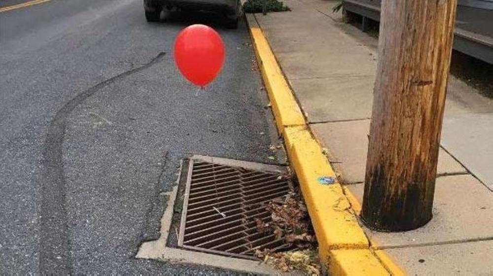 A red balloon is seen tied to a sewer grate in Lititz, Pennsylvania.