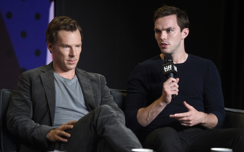 Benedict Cumberbatch, left, looks on as Nicholas Hoult speaks during a press conference for 