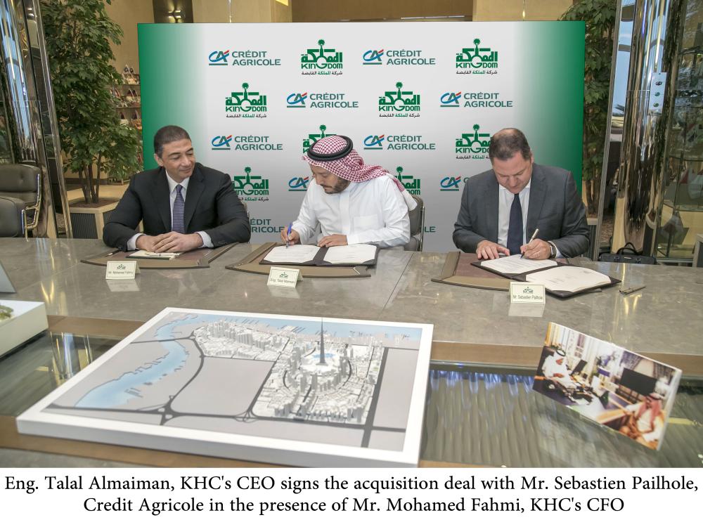 Eng. Talal Almaiman, KHC's CEO, signs the acquisition agreement with Sebastien Pailhole of Credit Agricole, in the presence of Mohamed Fahmi, KHC's CFO