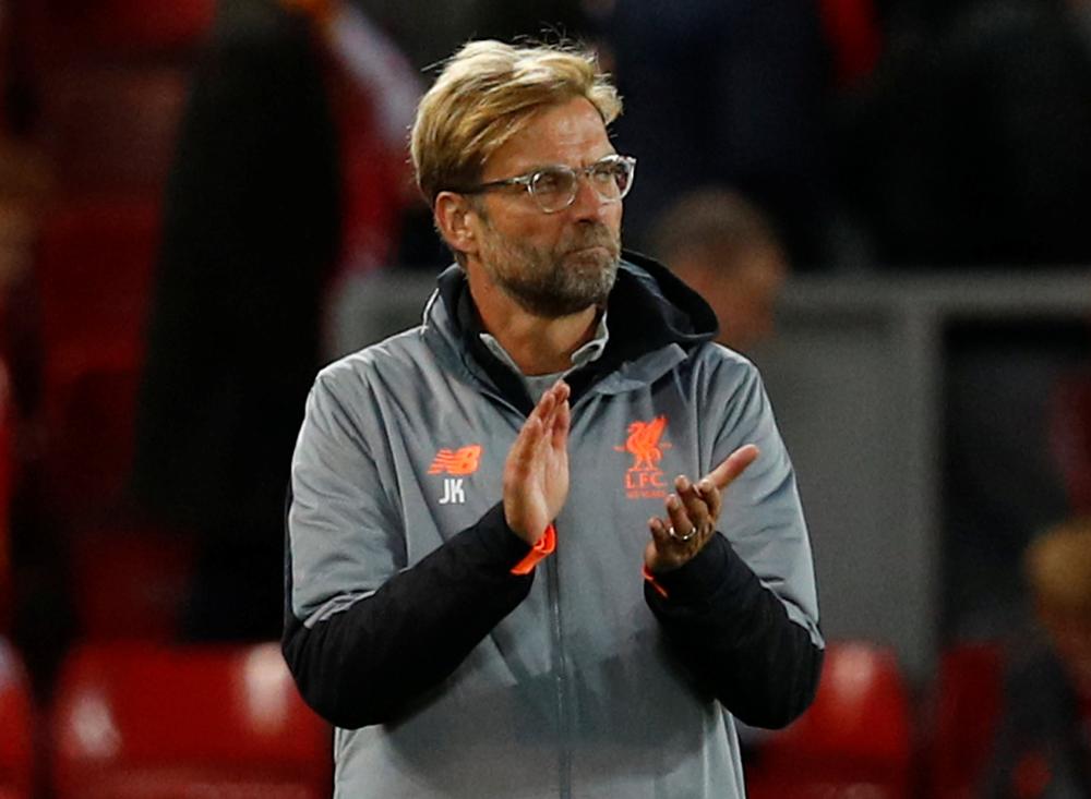 Liverpool manager Juergen Klopp applauds the fans at the end of the Champions League match  against Sevilla. — Reuters