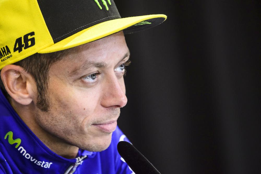 (FILES) This file photo taken on August 10, 2017 shows Valentino Rossi of Italy attending a press conference prior to the MotoGP Austrian Grand Prix weekend at Red Bull Ring in Spielberg, Austria. Crash victim Valentino Rossi was confirmed as a non-starter for this weekend's San Marino MotoGP, his Yamaha team announced on September 4, 2017. The Italian nine-time world champion is recovering from a broken leg after a training crash last week. / AFP / Jure Makovec
